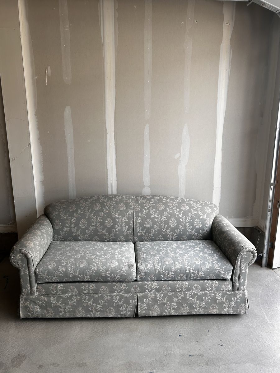 Sage green Floral Pattern Fabric loveseat with built in sleeper 