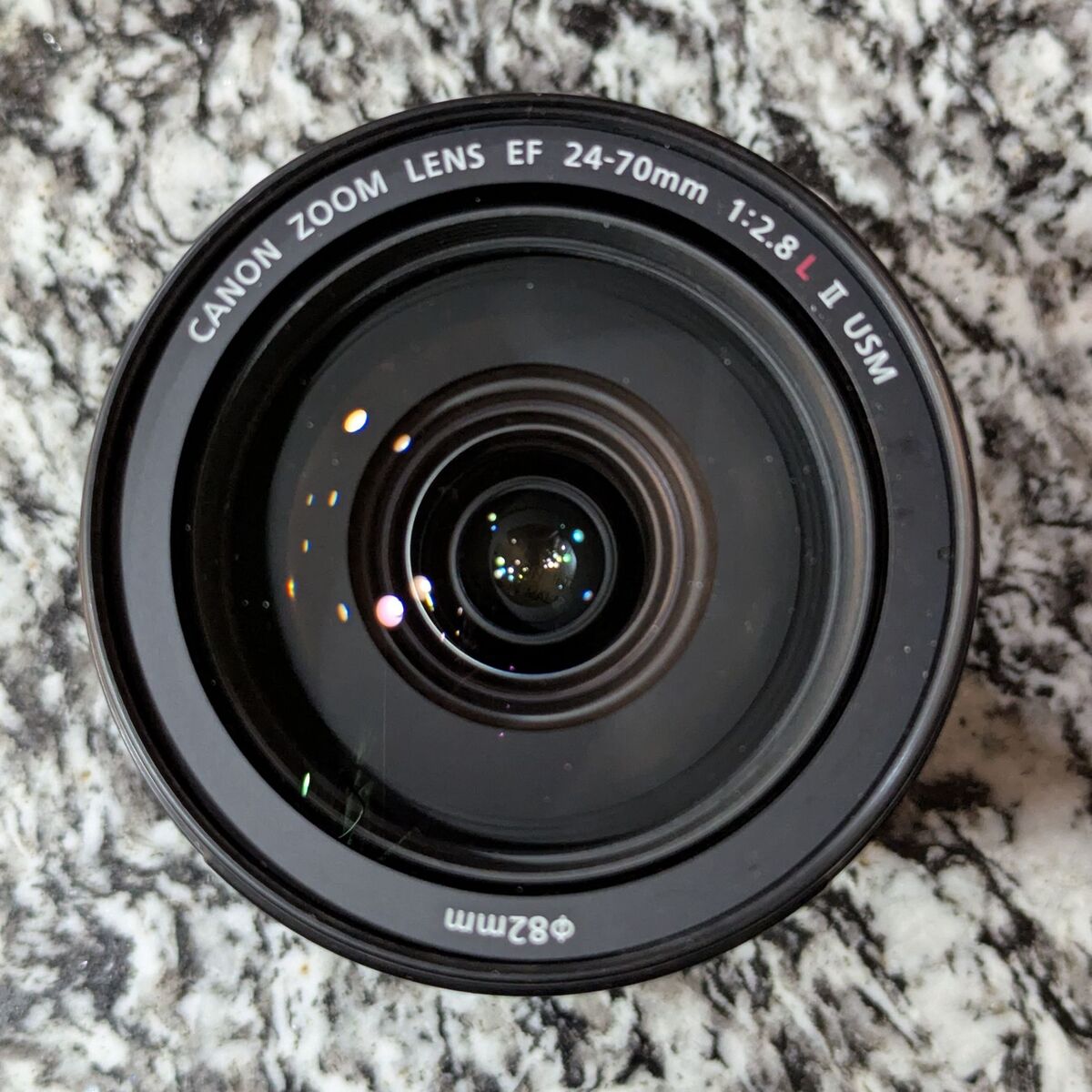 Gently used Canon EF 24-70mm f/2.8L lens with caps, hood, and filters