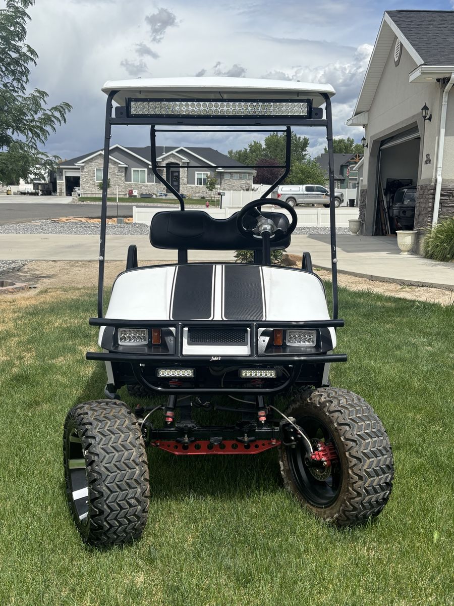 EZ-GO Custom Lifted Golf Cart with LED Light Bars and Off-Road Tires