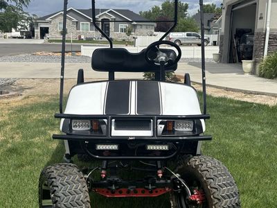 EZ-GO Custom Lifted Golf Cart with LED Light Bars and Off-Road Tires