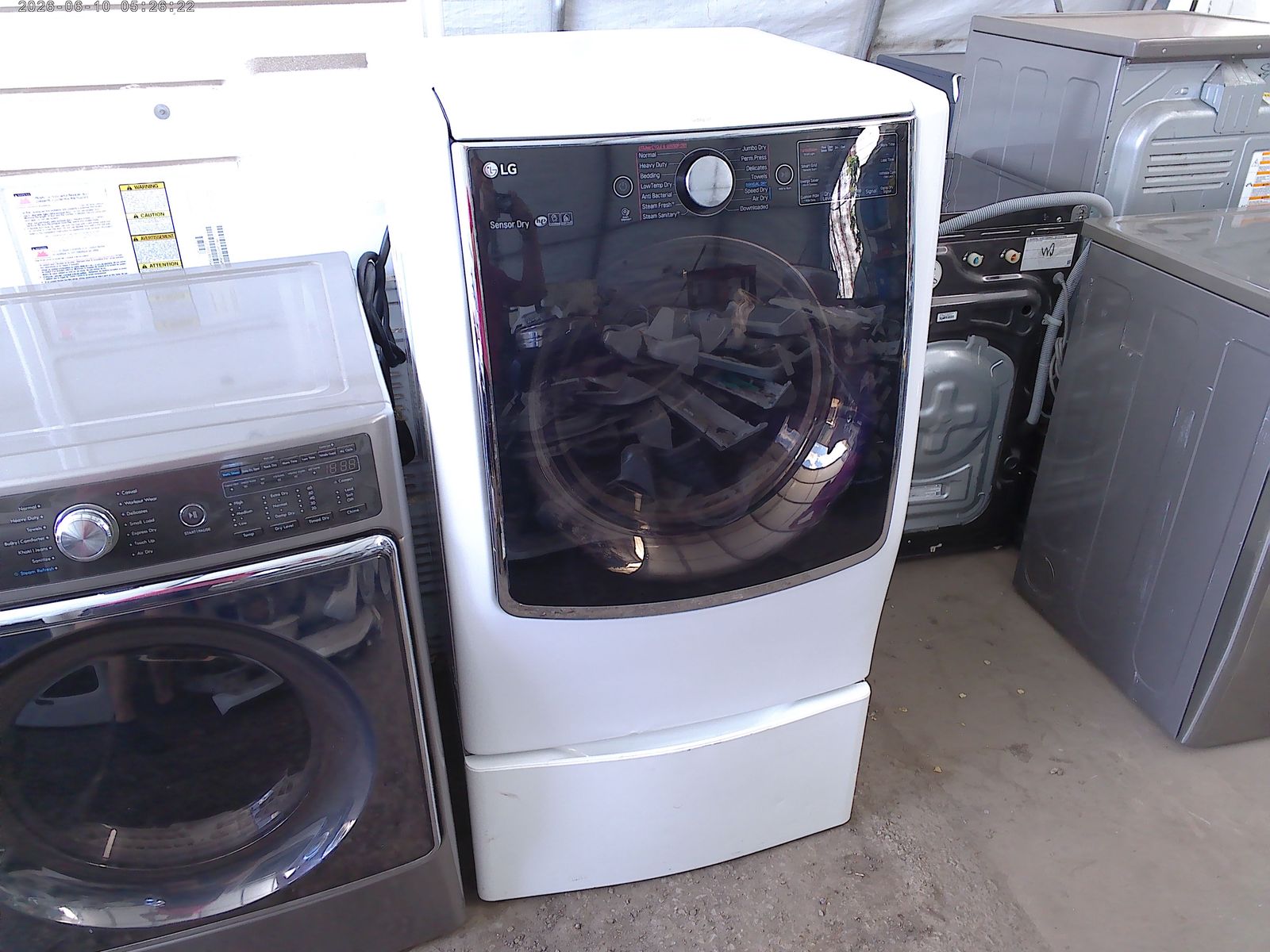 LG front load electric dryer on pedestal