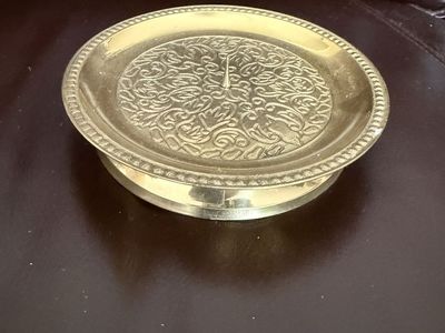 Brass intricate design candle holder stand a little over 5” wide by 1” tall