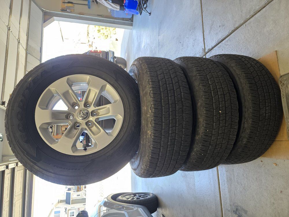 set of Ram 1500 tires and rims. 275/65r18