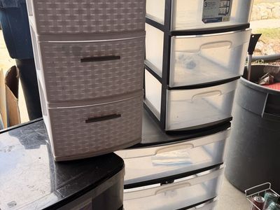 4 three drawer style plastic storage/filing cabinets