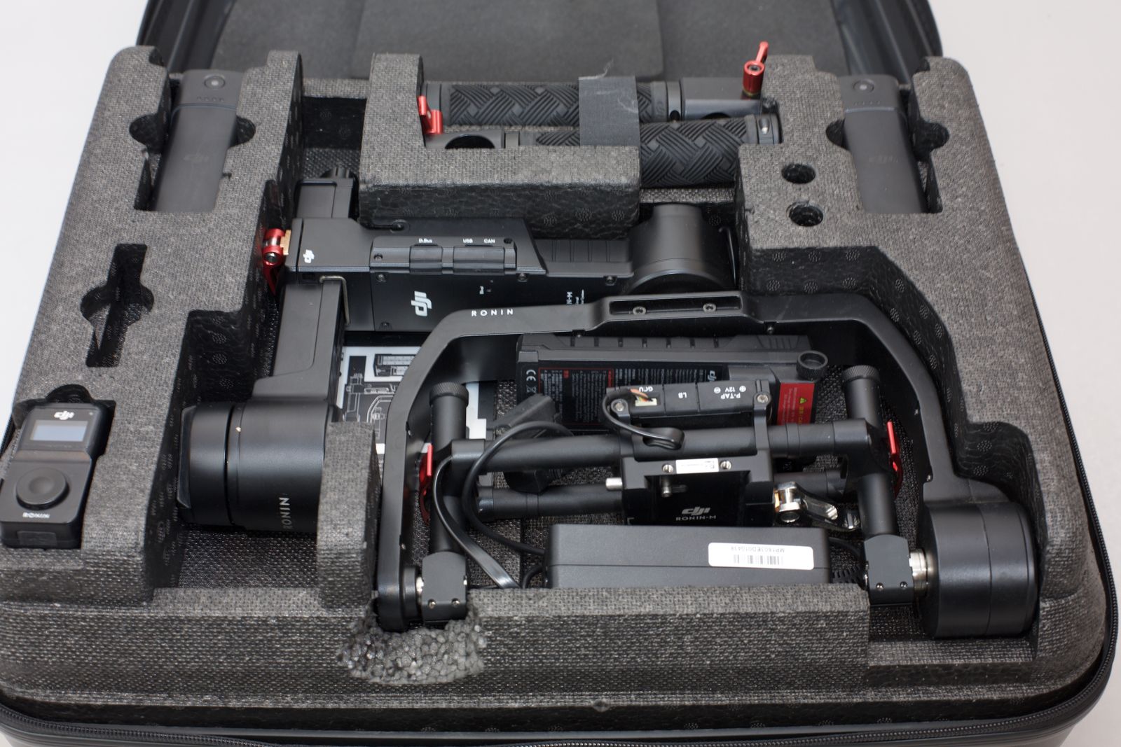 DJI Ronin-M 3-axis camera stabilization system with hard carrying case and accessories.