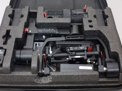 DJI Ronin-M 3-axis camera stabilization system with hard carrying case and accessories.