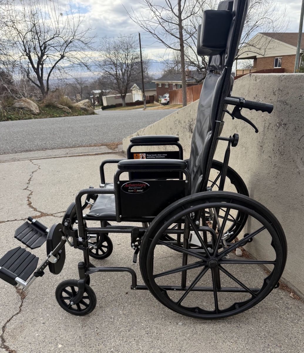 High back, reclining wheelchair in good condition 