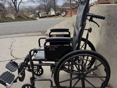 High back, reclining wheelchair in good condition