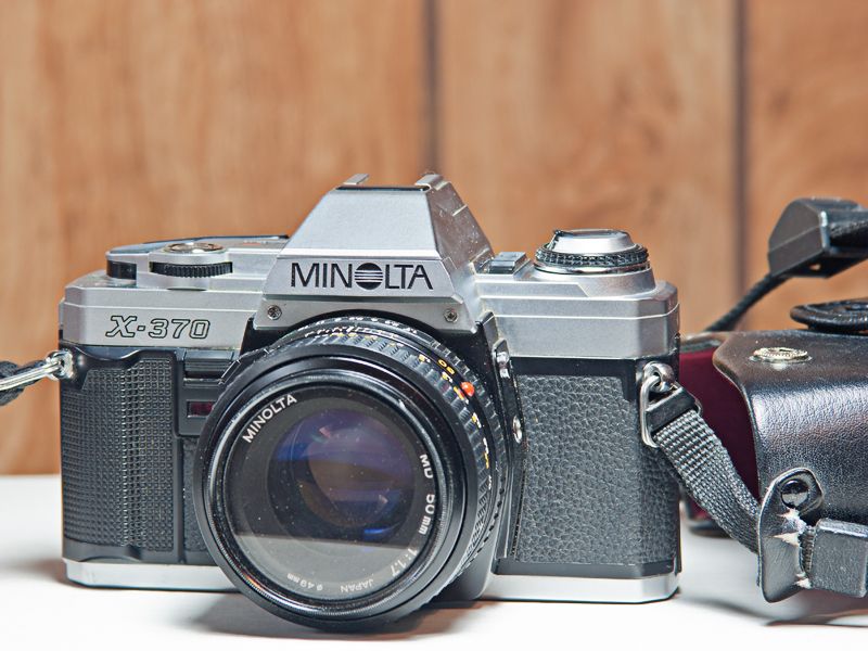 Minolta X-370 Film Camera w/Minolta 50mm f/1.4 MC Rokkor-PG Lens (55mm Filter Thread) and Leather Case.
