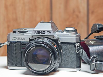 Minolta X-370 Film Camera w/Minolta 50mm f/1.4 MC Rokkor-PG Lens (55mm Filter Thread) and Leather Case.