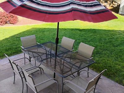 Patio table with chairs and umbrella