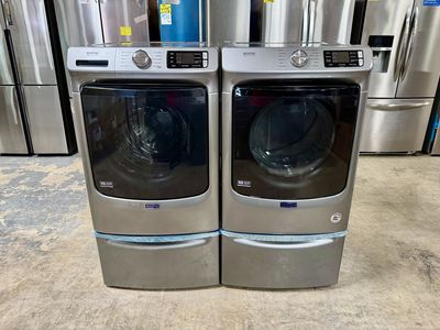 MAYTAG WASHER AND DRYER SET ON PEDESTALS