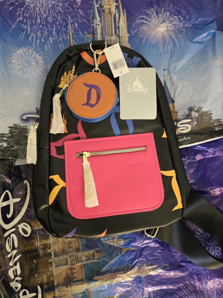 Disney Parks Sling Backpack Black with Colorful Prints and Coin Pouch New with Tags