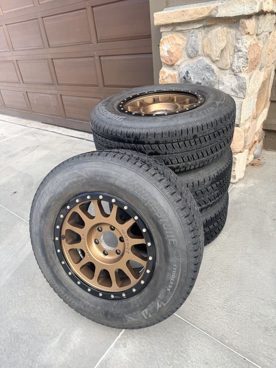 Method MR305 Bronze Rims / Wheels 18X9 6-135.00 18 offset and Bridgestone Blizzak Tires LT275 /70 R18