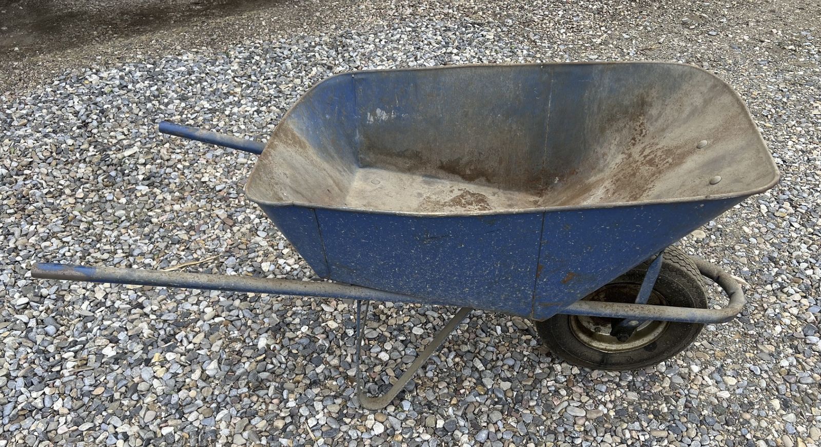Heavy-Duty Blue Metal Wheelbarrow with Single Wheel - Used Garden & Construction Cart