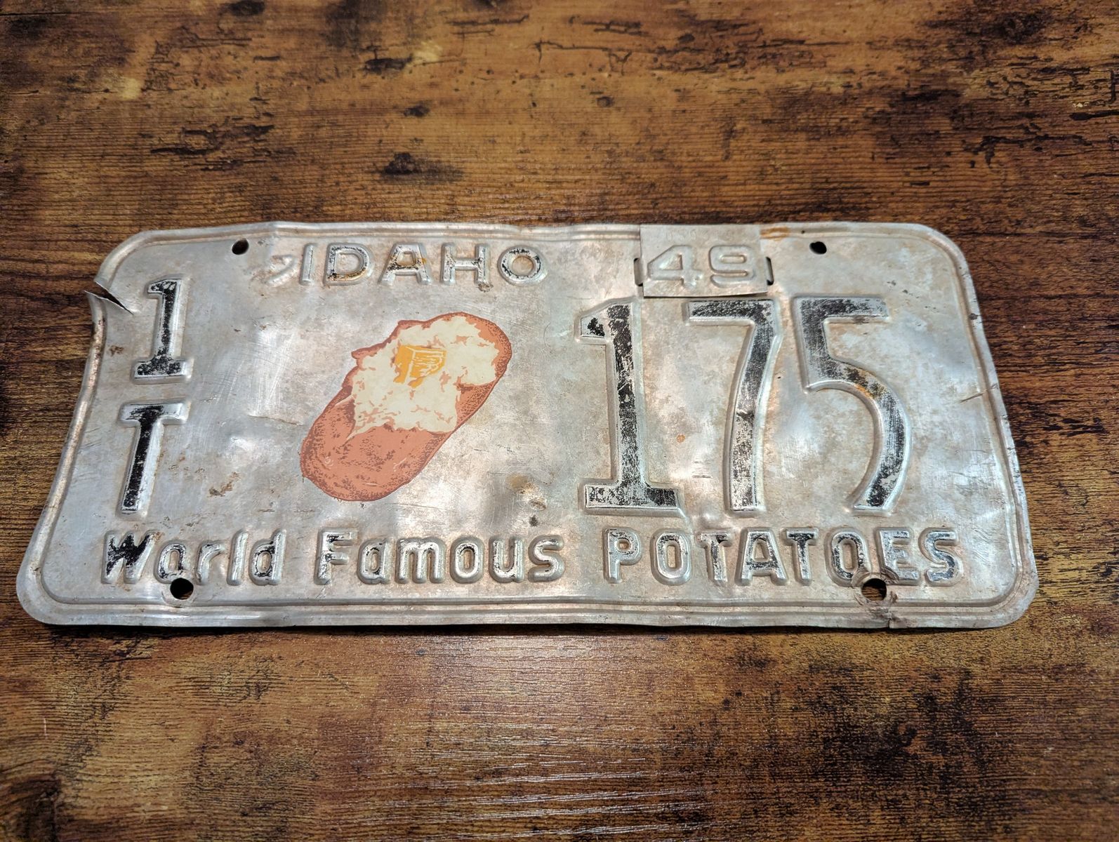 THE ULTIMATE IDAHO LICENSE PLATE "WORLD FAMOUS POTATOES" 1949