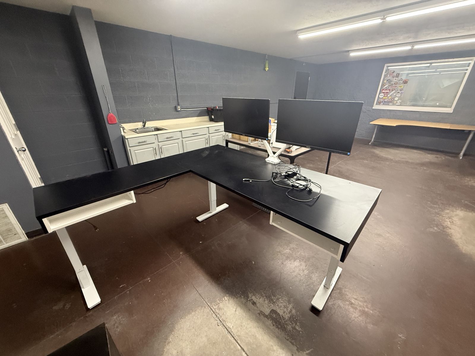 L-Shaped Motorized Adjustable Standing Desk with Shelving & Storage Units. With or without dual monitors