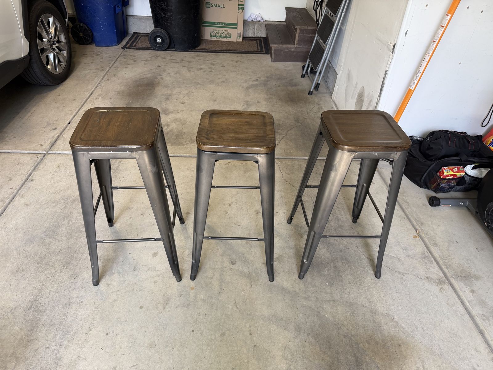 Three metal 30” tall bar stools