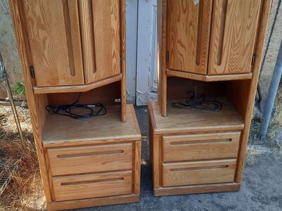 two tall matching nightstands with light