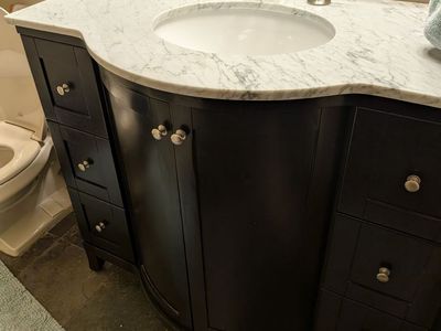 Dark Wood Bathroom Vanity with Marble Countertop, Undermount Sink, and Faucet