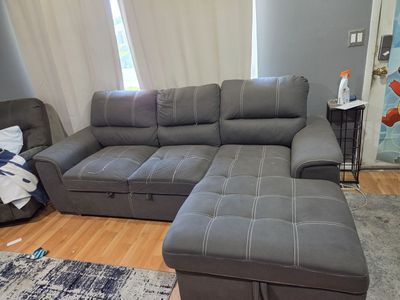 Gray Sectional Sofa with Pull-Out Bed and Storage Chaise - Versatile Living Room Furniture