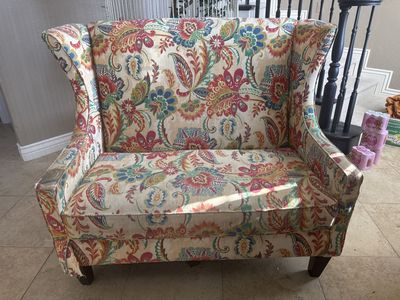 Floral wingback loveseat
