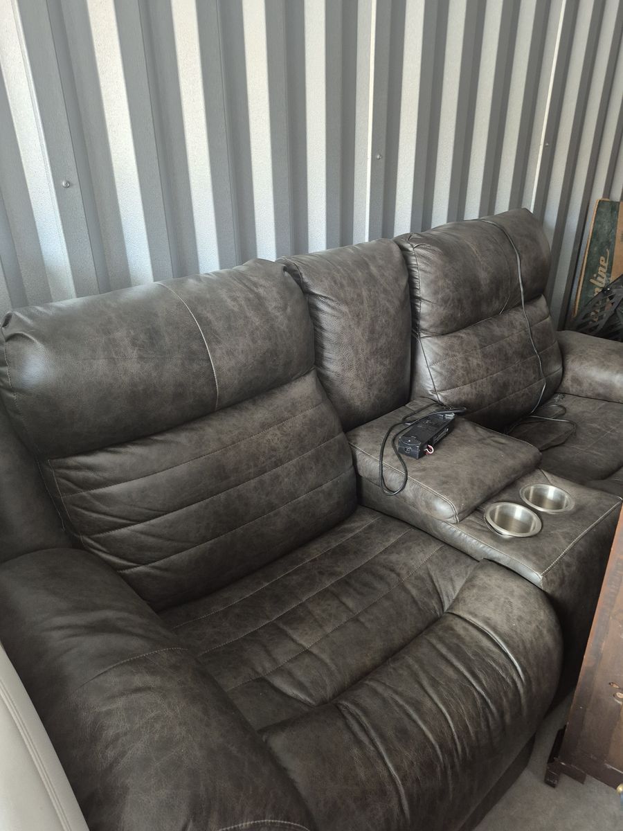 Brown leather reclining couch