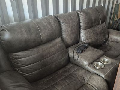 Brown leather reclining couch