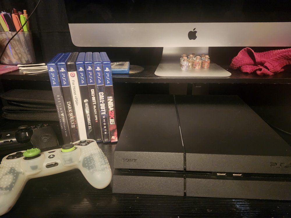 Sony PlayStation 4 Console Bundle with Two Controllers and 7 Games