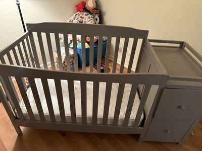 Crib with built in dresser