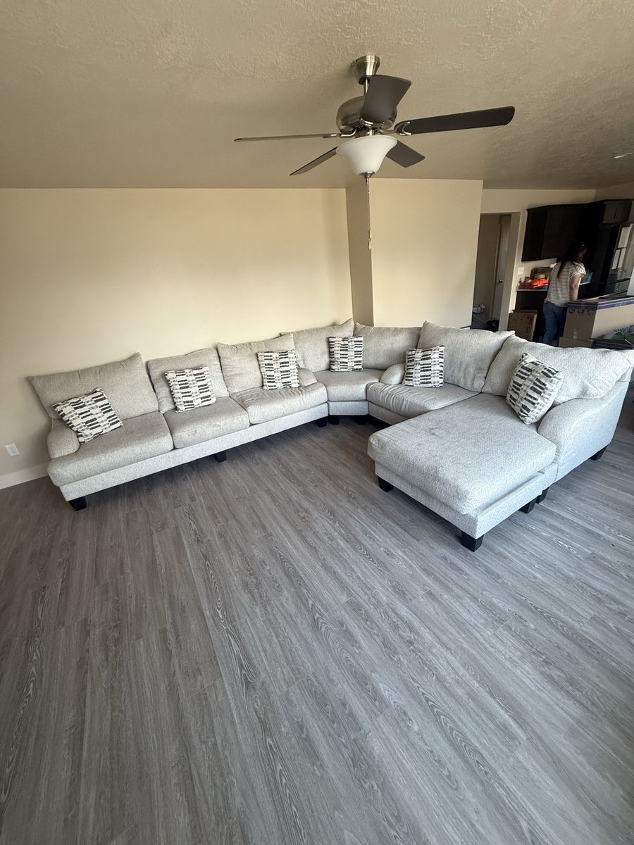 Large Light Gray Sectional Sofa with Chaise and Throw Pillows