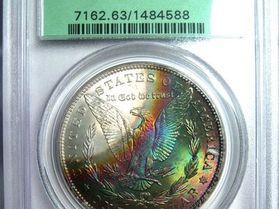 1885-O RAINBOW TONED MORGAN DOLLAR PCGSMS63 OGH PCGS