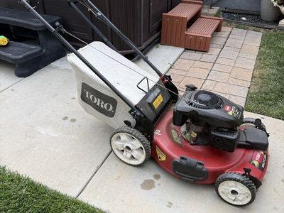 Toro self propelled lawnmower with big wheels in back!