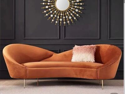 Orange velvet curved sofa