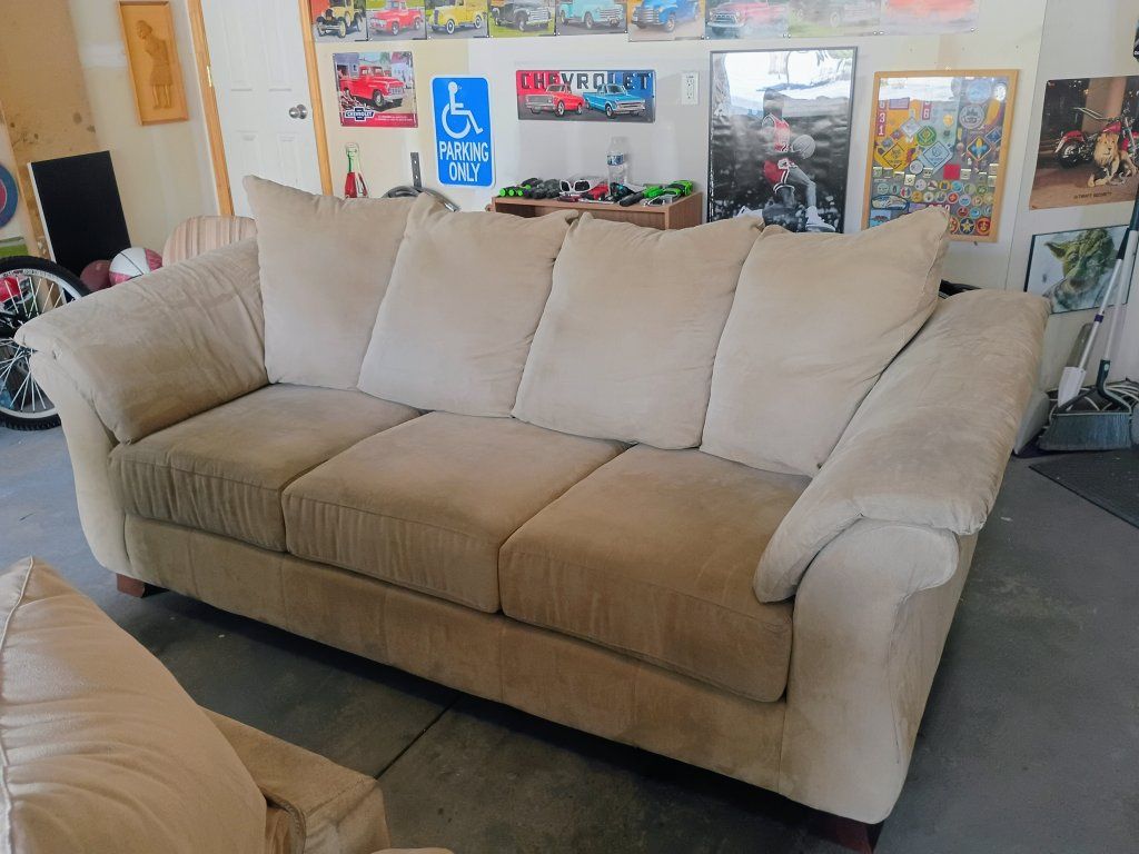 2 matching beige Microfiber couches in excellent condition with no rips or tears asking $65 for both