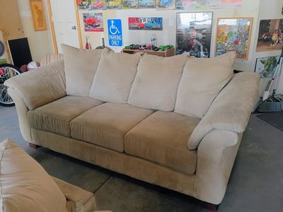 2 matching beige Microfiber couches in excellent condition with no rips or tears asking $65 for both