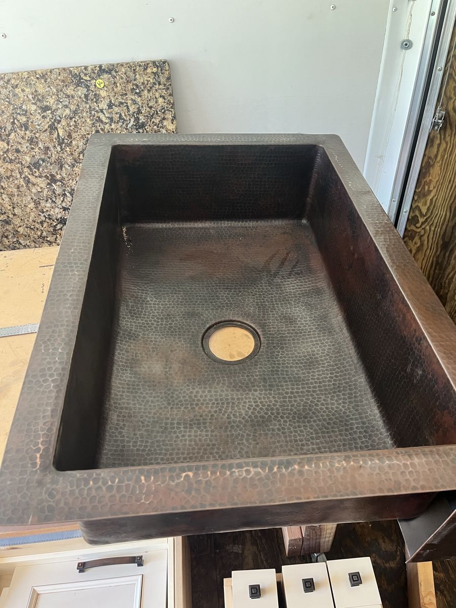 Kitchen island with hammered copper sink