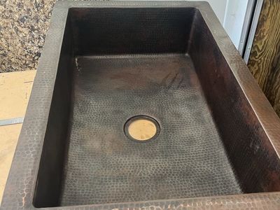 Kitchen island with hammered copper sink