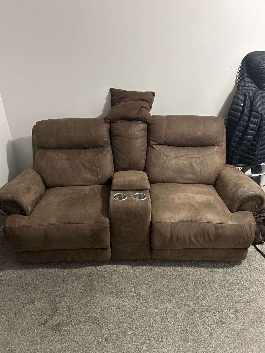 Brown Microfiber Reclining Loveseat with Center Console and Cup Holders. $100 or best offer. 
