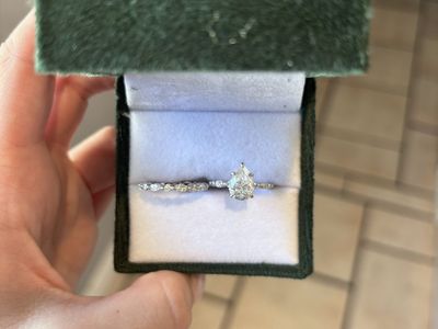 Pear-Cut Solitaire Moissanite Engagement Ring and Matching Band Set in Green Velvet Box