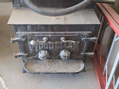 Vintage Woodsman Cast Iron Wood Burning Stove