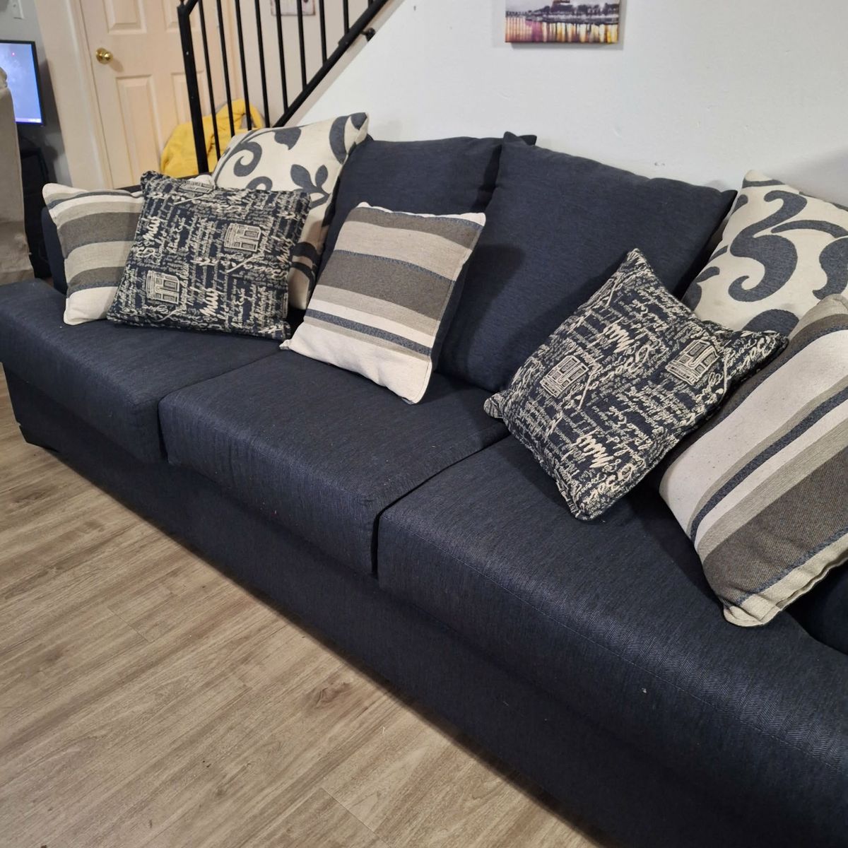 Blue Couch with Throw Pillows