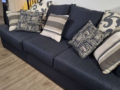 Blue Couch with Throw Pillows