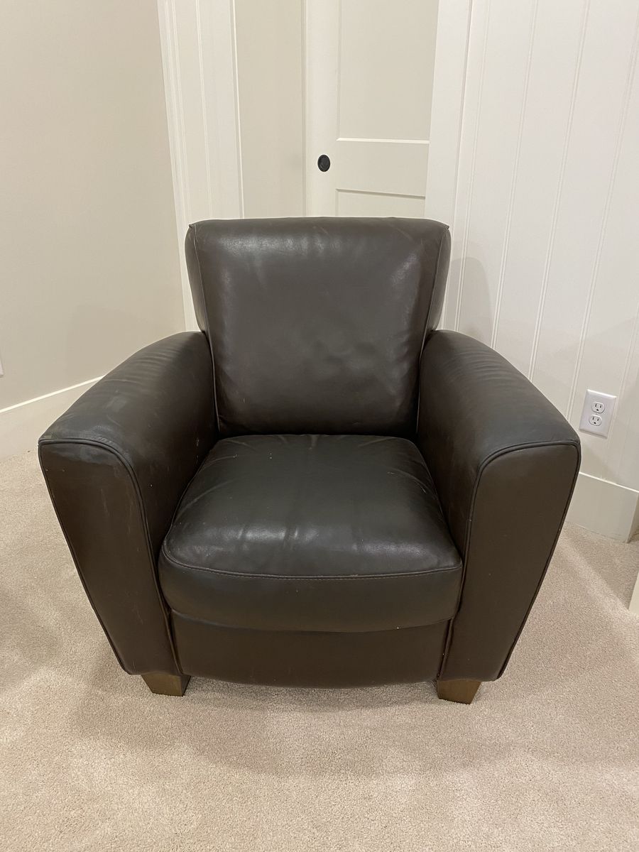 Well loved Dark Leather Armchair