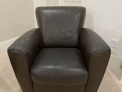 Well loved Dark Leather Armchair