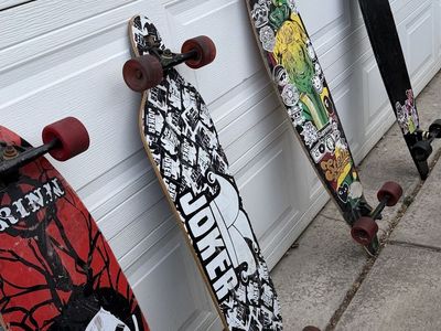 Lot of Assorted Longboards Skateboards Various Graphic Designs