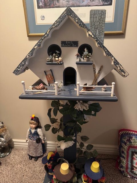 decorative Scandinavian-style pedestal birdhouse or garden display, likely made for indoor décor rather than outdoor use.
