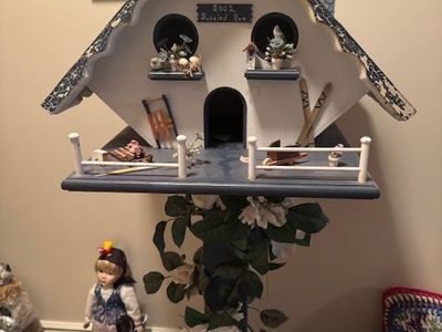 decorative Scandinavian-style pedestal birdhouse or garden display, likely made for indoor décor rather than outdoor use.