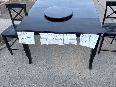 Black dining room table with built-in leaf and Lazy Susan
