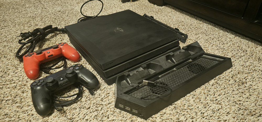 Sony PlayStation 4 Console with Two Controllers and Stand